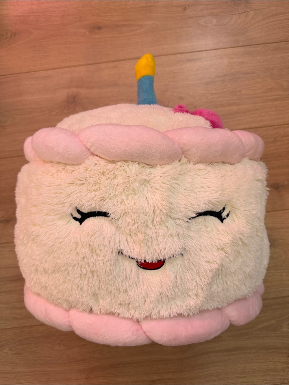 Plush Smiling Cake Slice Pillow in Cream & Pink with Blue Candle Squishable